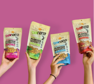 Four hands modeling different flavored Barnana products against a pink backdrop