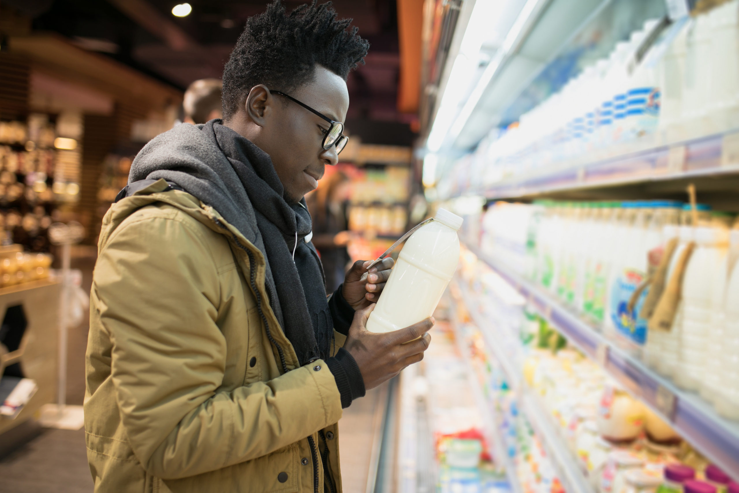 Man reading milk label