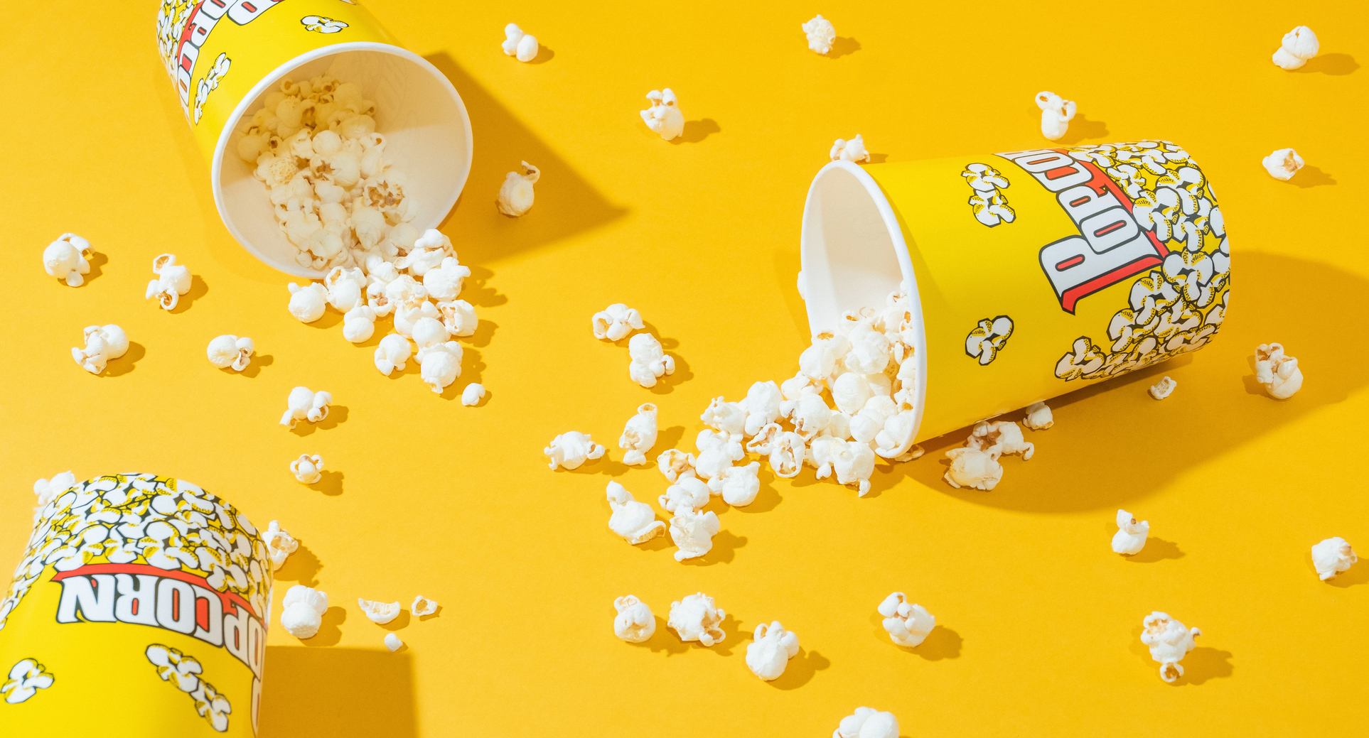 Popcorn bucket / Popcorn on yellow background.