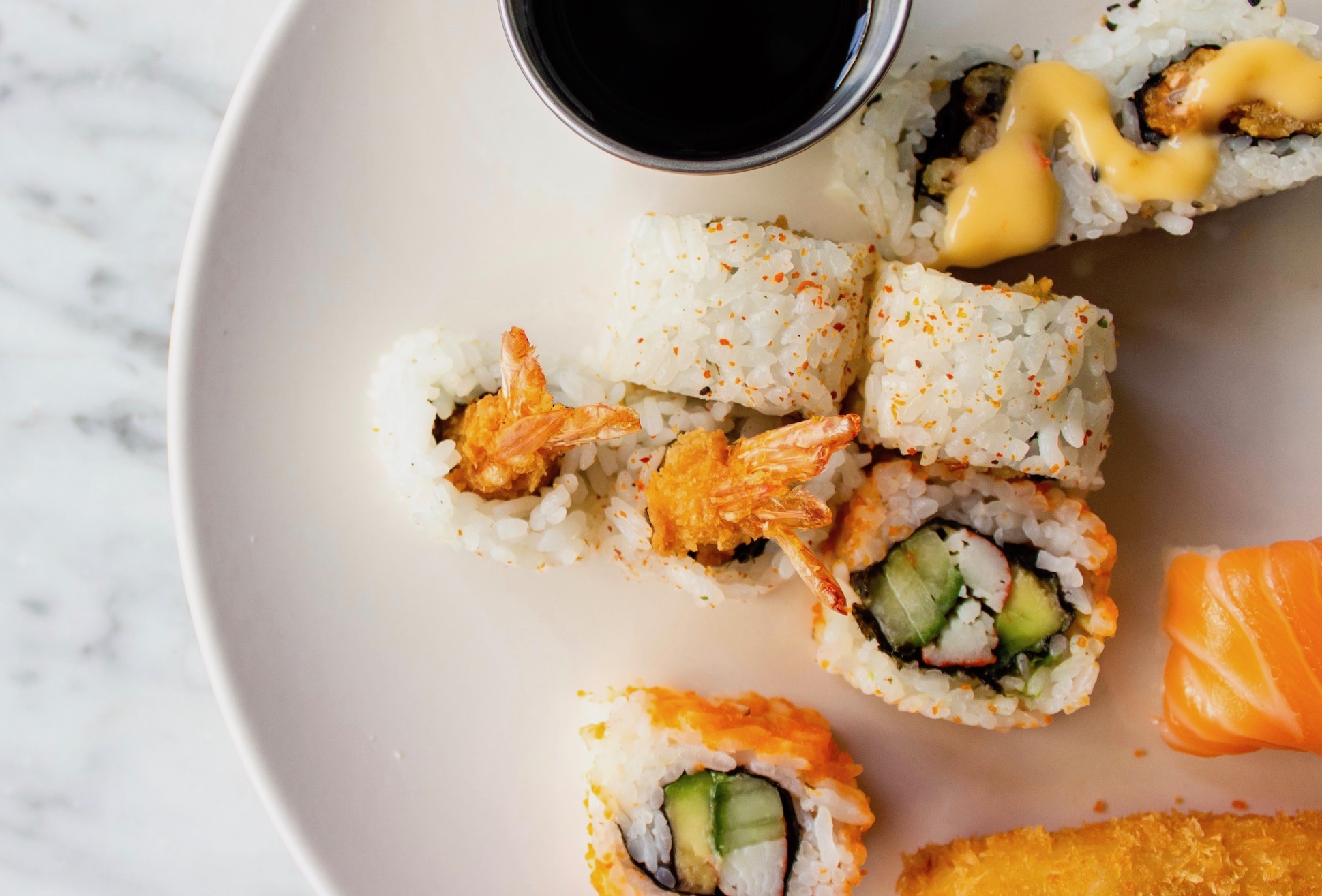 sushi roll on plate with soy sauce