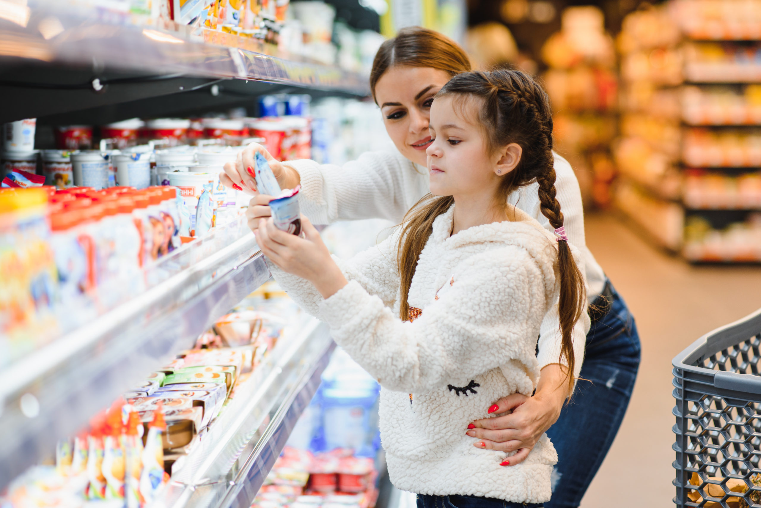 Mother with daughter at a grocery store