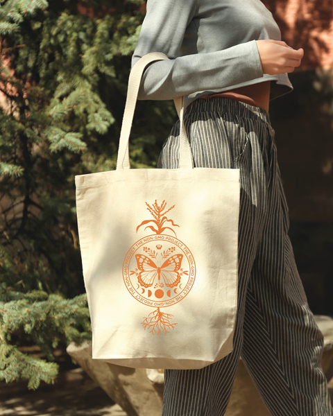 Woman carrying a canvas tote bag on her arm