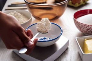 Flour in a spoon before weighing it